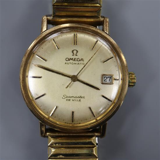 A gentlemans yellow metal Omega Seamaster De Ville automatic wrist watch, on associated flexible strap.
